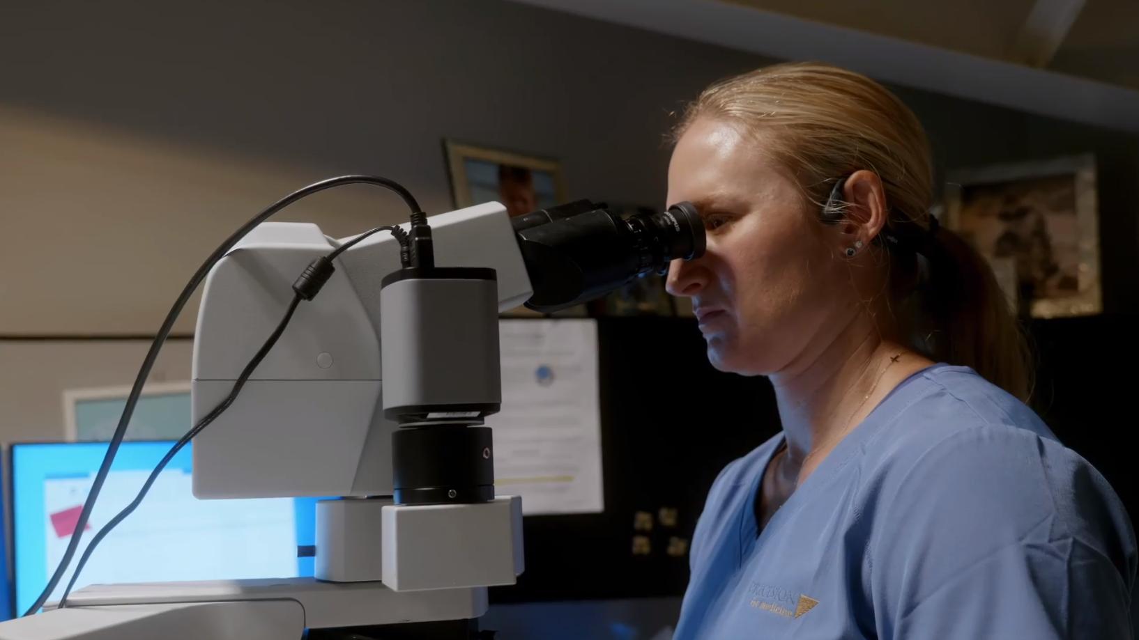 Pathologist at microscope